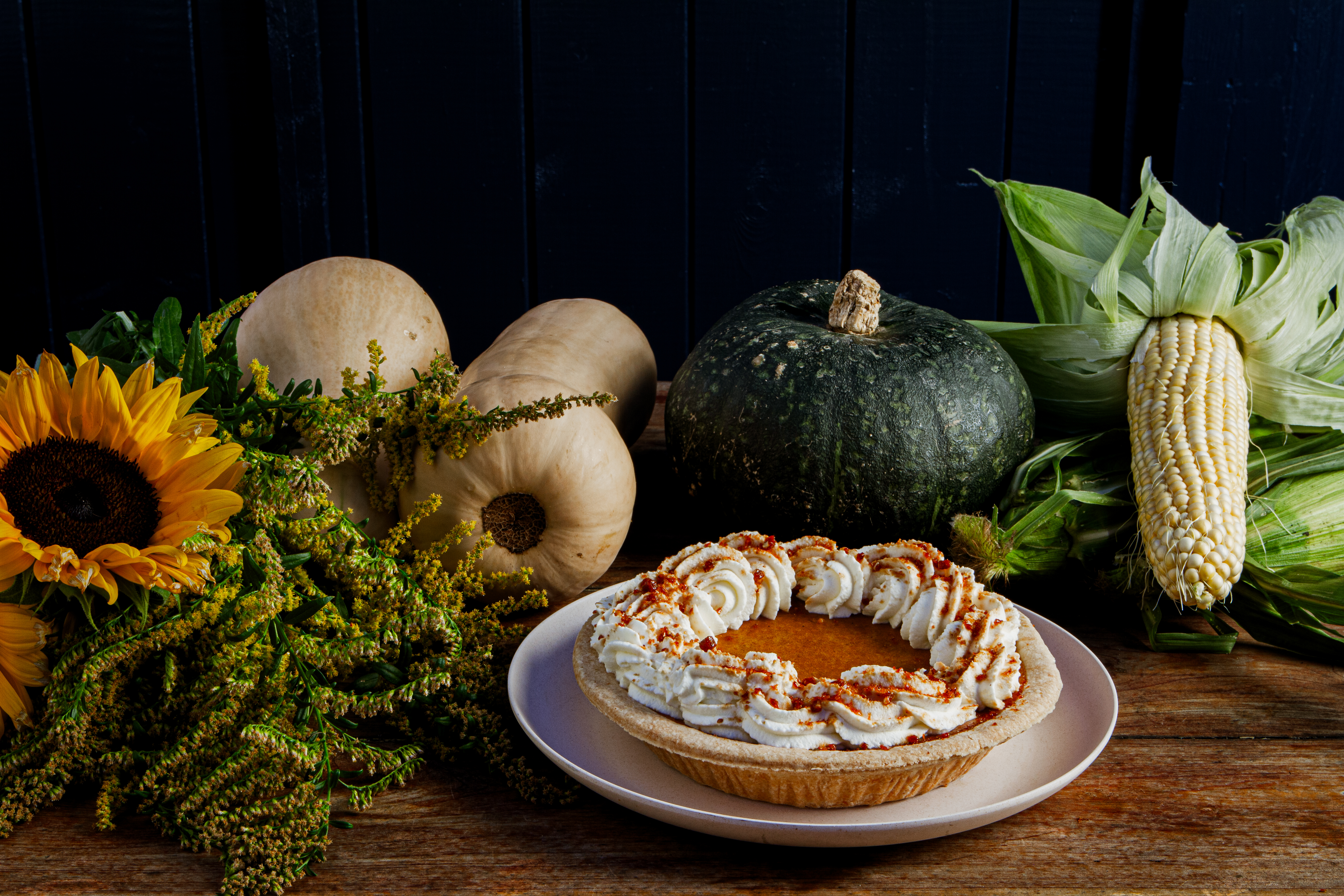 Thanksgiving pumpkin pie on a rustic table